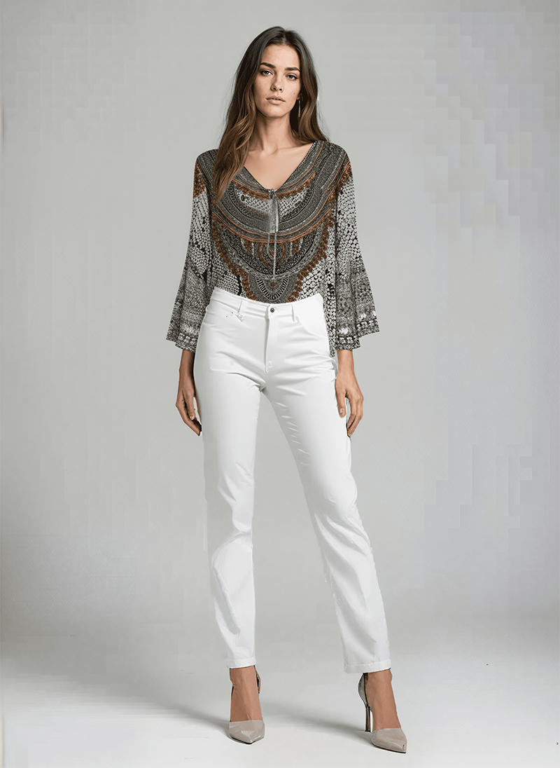 Model wearing the Bondi Resortwear The White Snake Boho Top styled as elegant coastal resort wear in Australia