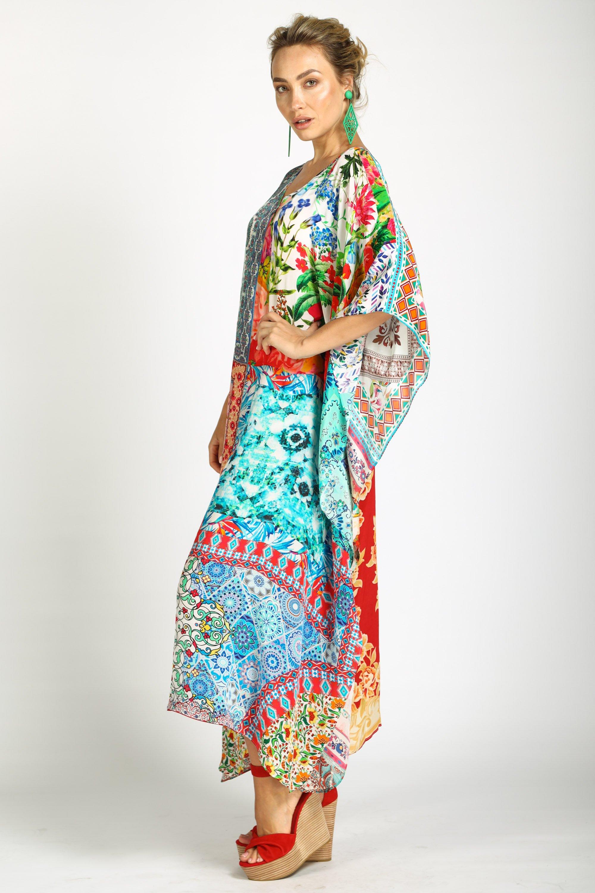 Side view of long kaftan dress in bright floral print, showing the elegence of women.