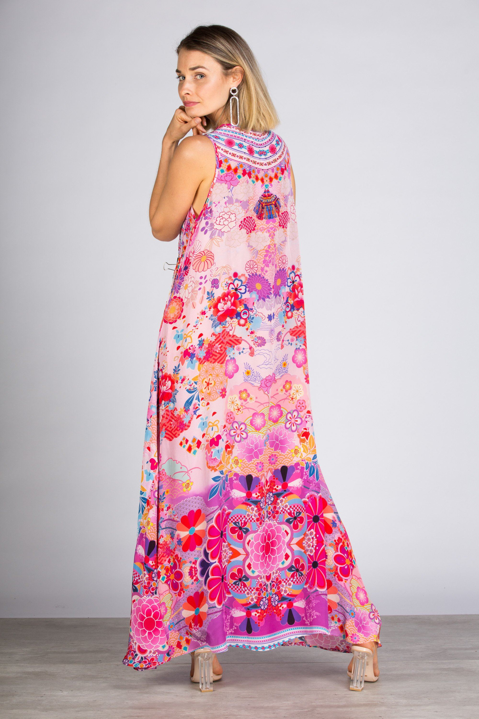 Model posing in the Bondi Resortwear Cherry Blossom Flowing Maxi Dress showcasing its soft feminine drape