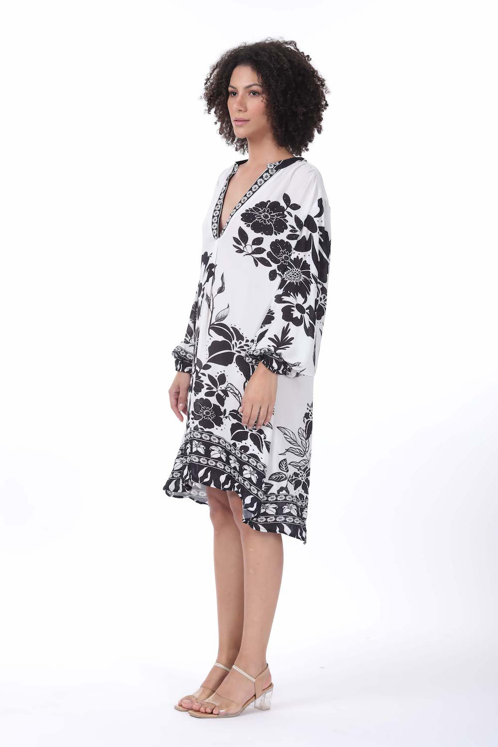 Side view of the black and white AVANTI Blouson Tunic Dress - Stylish Women's Outfit soft viscose fabric