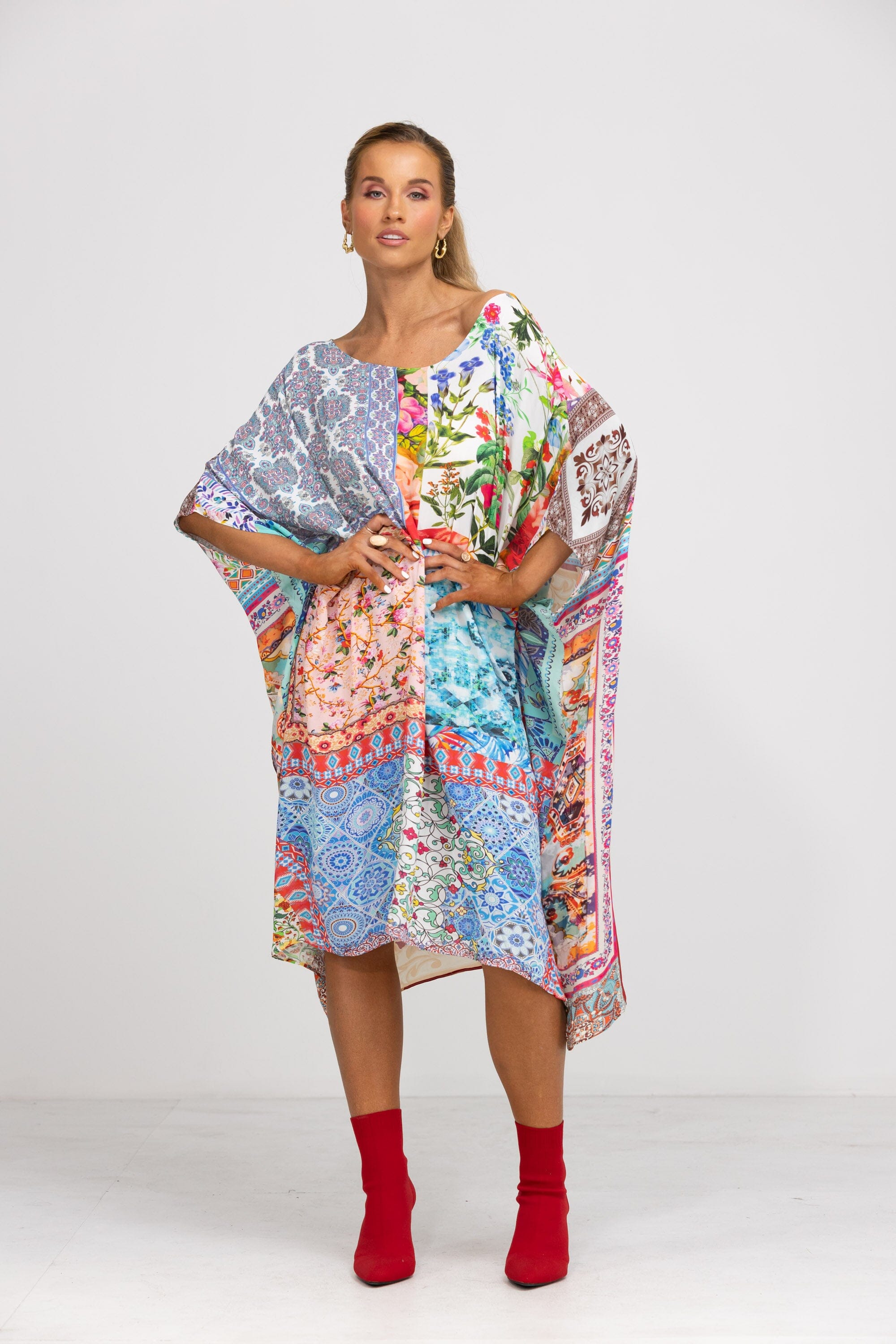 Short Box Kaftan dress in the bold Damascus patchwork print. This kaftan is styled with a one-shoulder neckline and has a handkerchief hem, perfect for resort or festival wear.