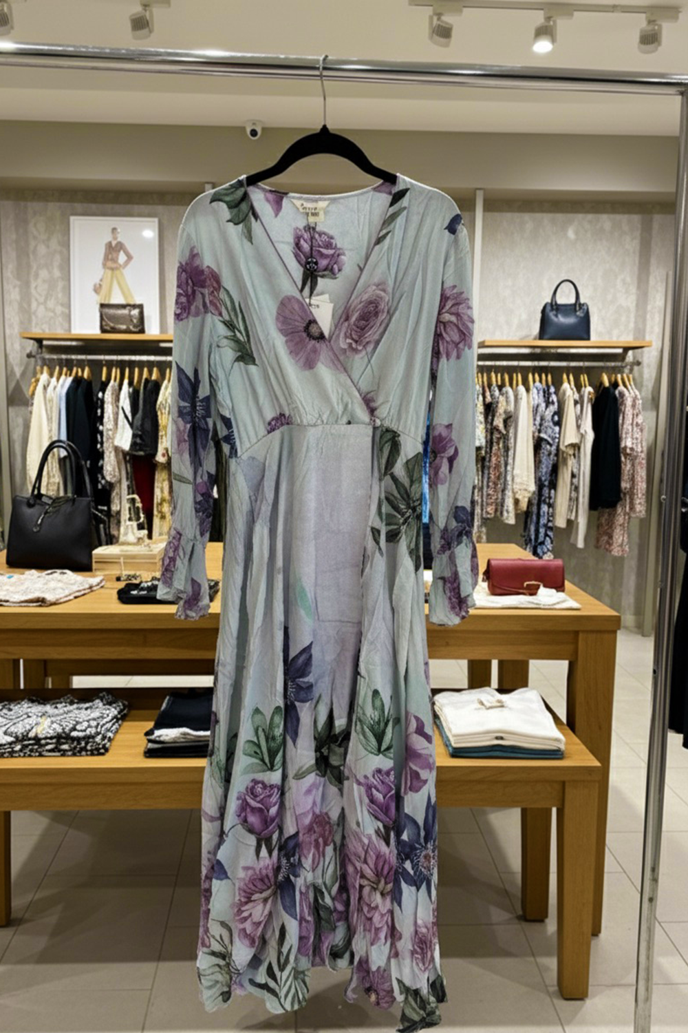 the Bondi Resortwear Maric Floral Robe Dress showing its soft flowing movement and summer elegance