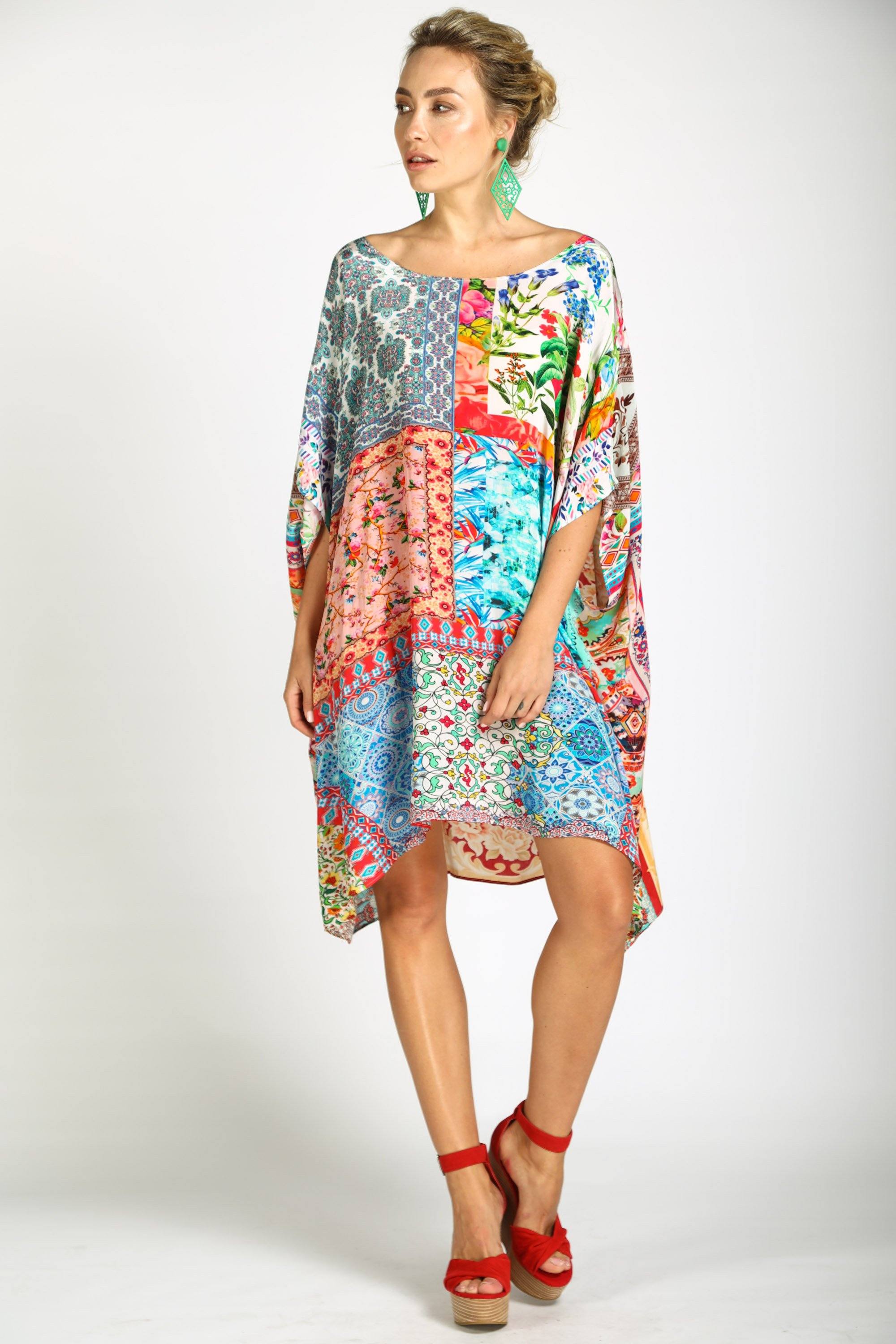 Damascus Short Box Kaftan dress by Bondi (formerly TheSwankStore). This kaftan features an intricate, mixed-media digital print with diverse patterns including ornate florals, animal motifs, and geometric designs in vivid blues, reds, and oranges.