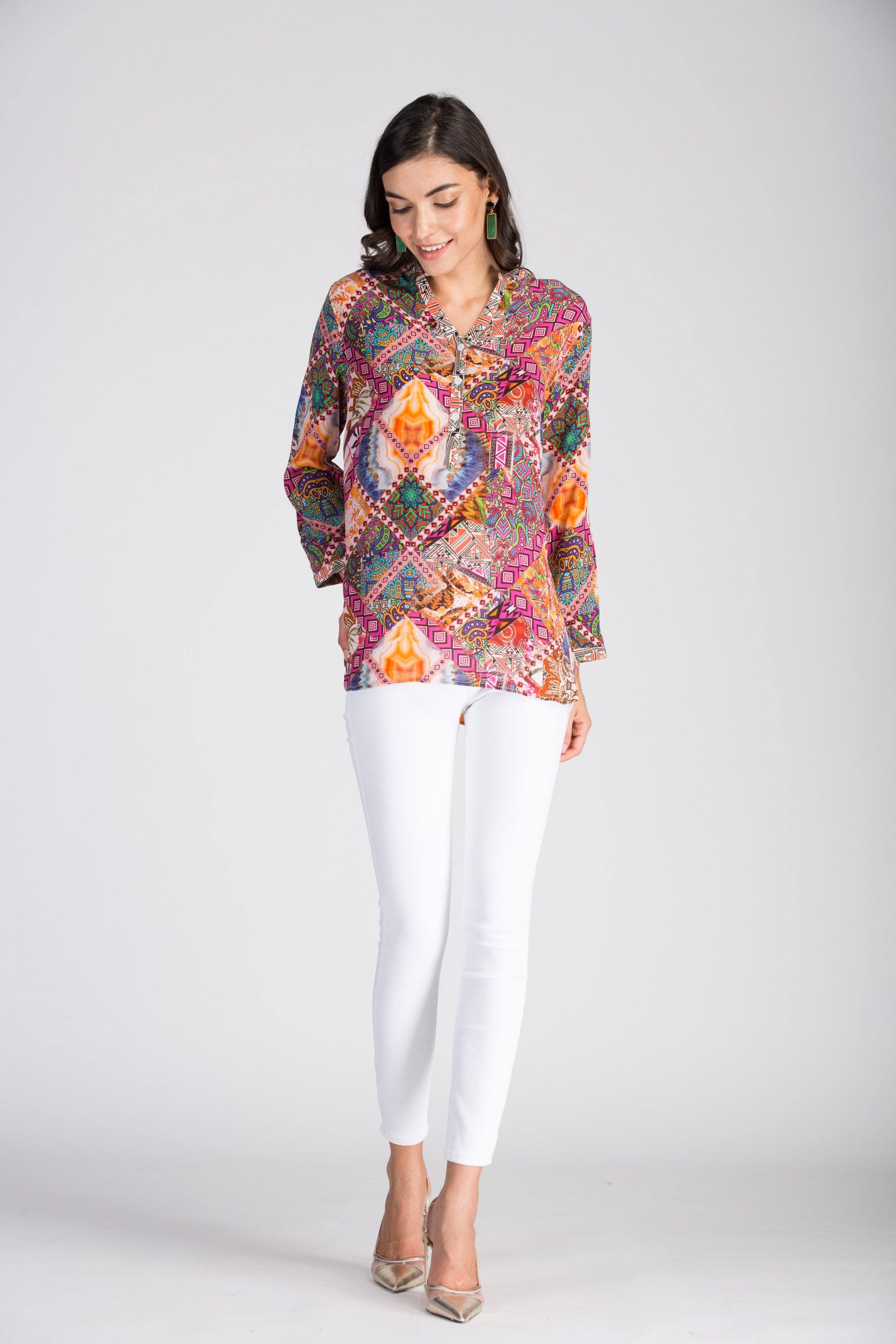 Woman wearing the Tunisia Milano Shirt in a relaxed coastal resort standing.