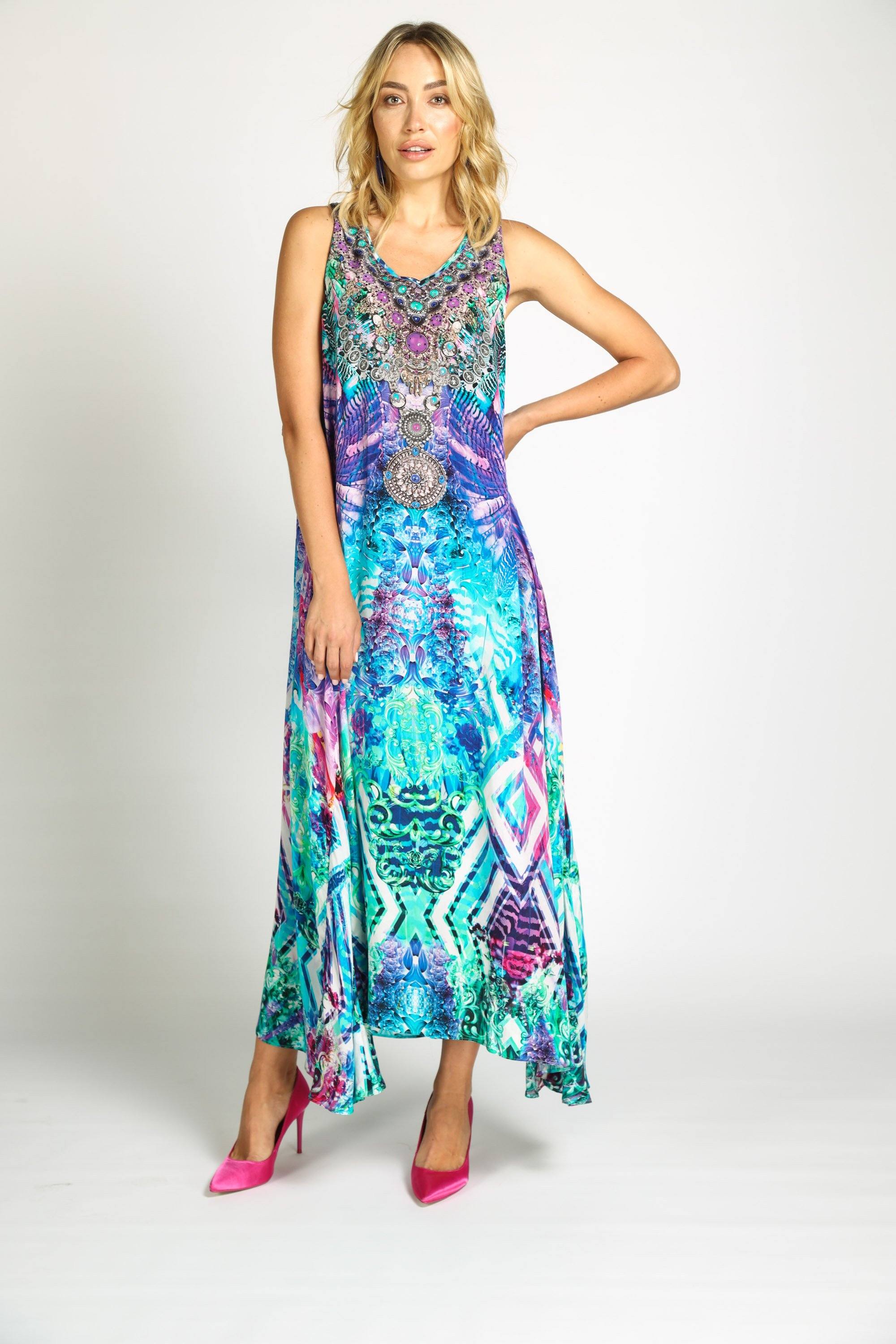 Model posing in the Zaffari Flowing Maxi Dress from Bondi Resortwear for a feminine resort wear look